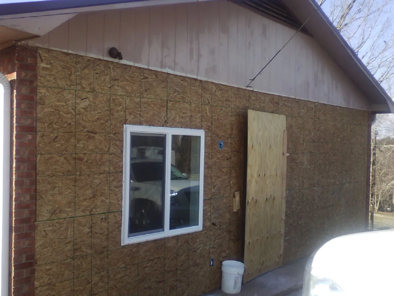OSB sheathing on a garage addition wall before siding in Bellingham